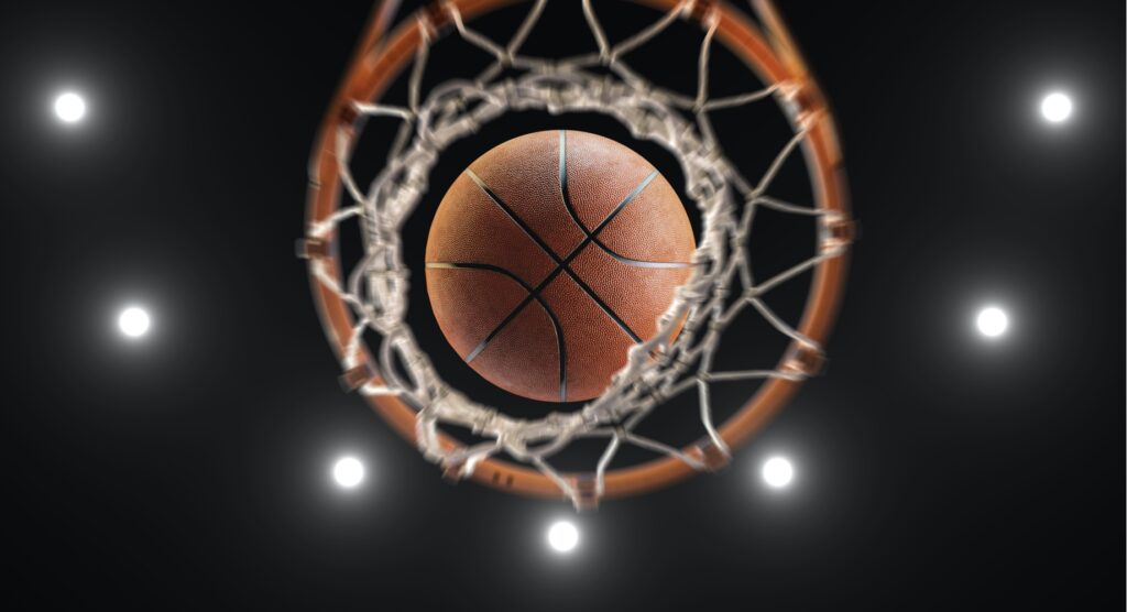 Worm's-eye view of basketball falling through net