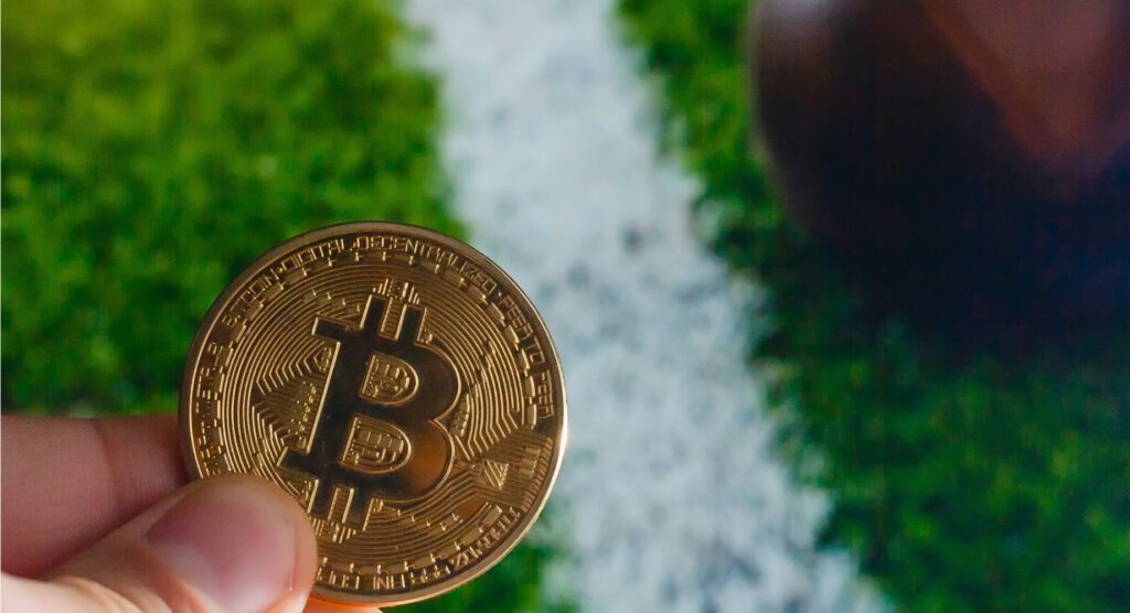 Man holding bitcoin-style coin