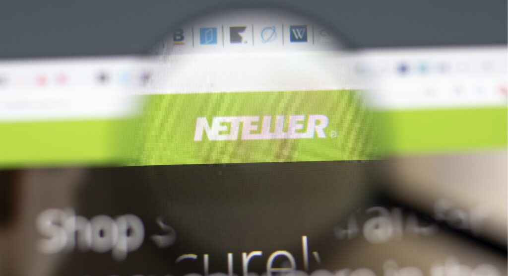 NETELLER logo in focus through magnifying glass